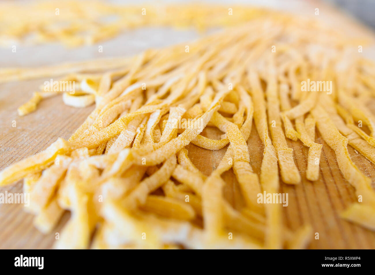 (selective focus) Fresh pasta called 'Fettuccine' made from fresh eggs