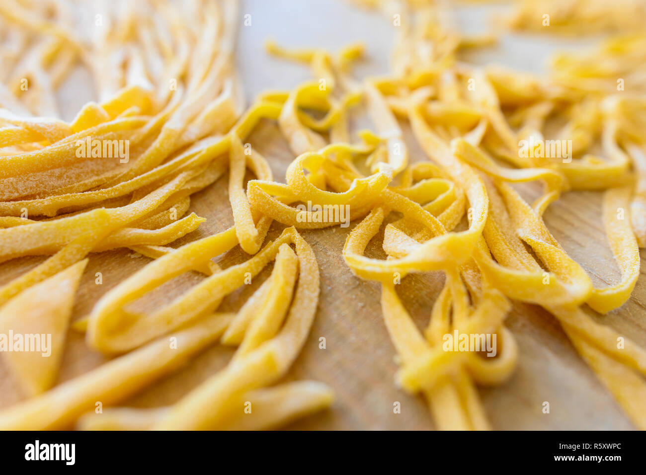 (selective focus) Fresh pasta called 'Fettuccine' made from fresh eggs