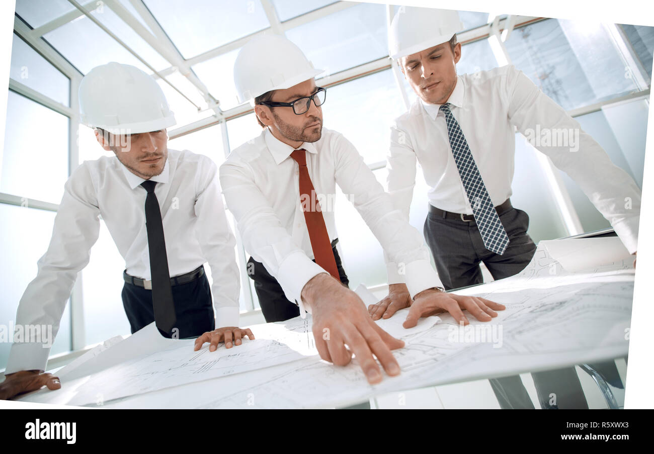 group of architects discussing sketches Stock Photo