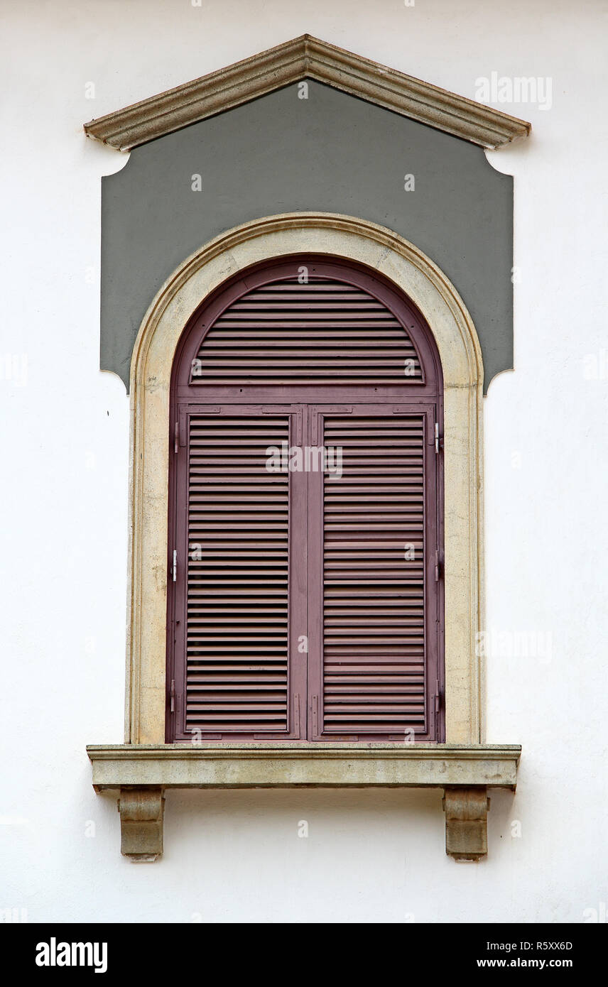 Close up of 17th century Portuguese era building facade with Corinthian style architecture window in Old Goa, India Stock Photo
