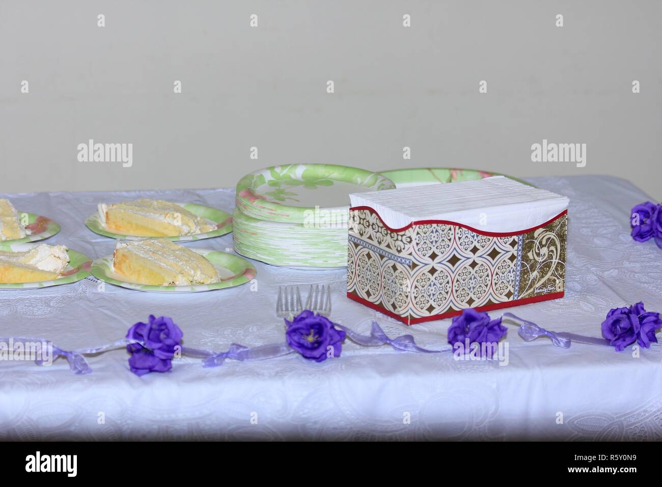 Wedding Cake At A Wedding Reception On Plates With Napkins Shot