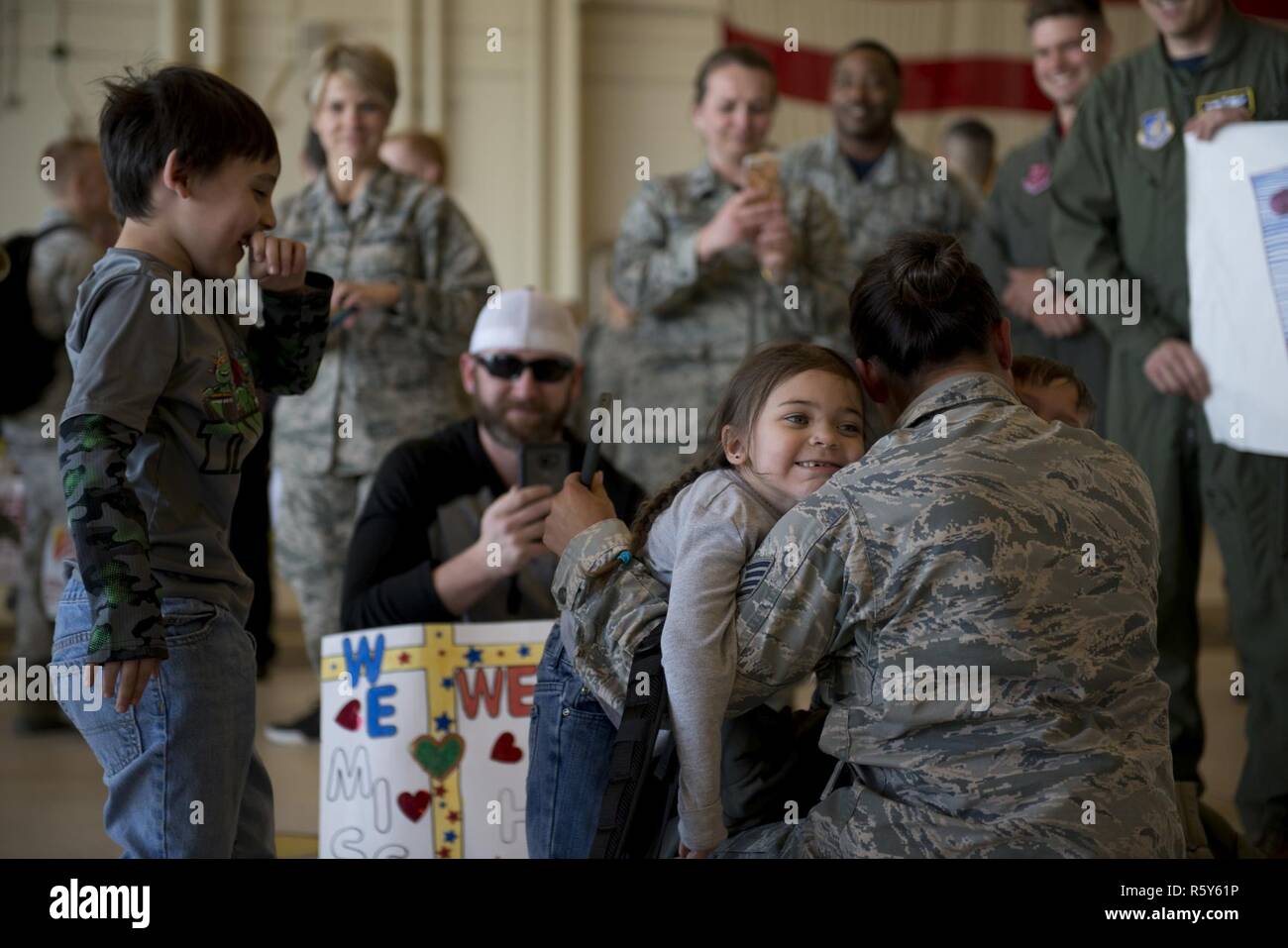 Friends and Families reunite at Hangar 25 on Joint Base Elmendorf-Richardson, Alaska April 21 as the 525th Fighter Squadron to return from a 7-month deployment. For many families, this was their first time being separated from their loved ones for an extended period of time. Stock Photo