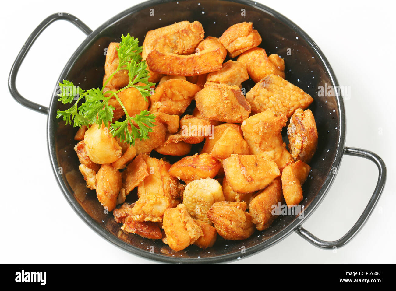 Pork greaves in a skillet Stock Photo - Alamy