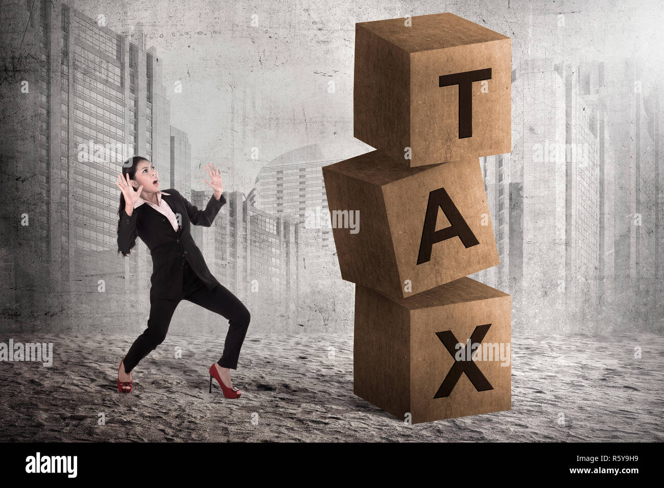 Tax Blocks Asian business woman shock looking tax block Stock Photo - Alamy