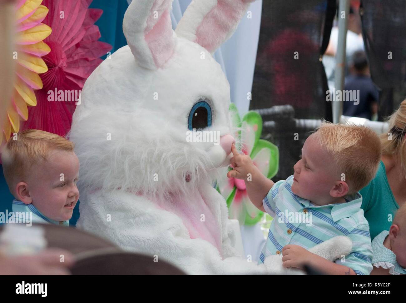 SCHOFIELD BARRACKS — Sawyer Hawes, 2, pokes the Easter Bunny during the