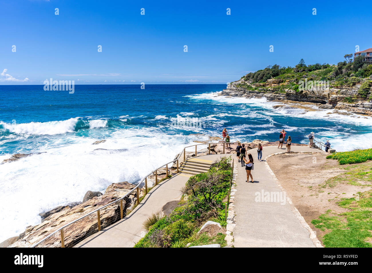 The classic Sydney Coastal walk from Bondi Beach to Coogee Beach is a favourite among locals and tourists. Stock Photo