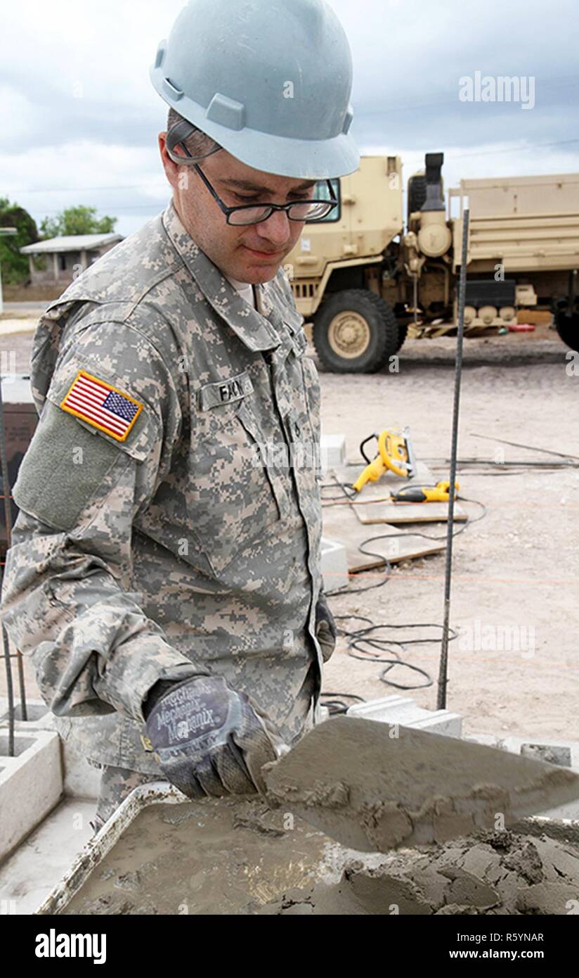 Pfc. Imanuel Fayn, a carpenter with the 808th Engineer Company, uses a