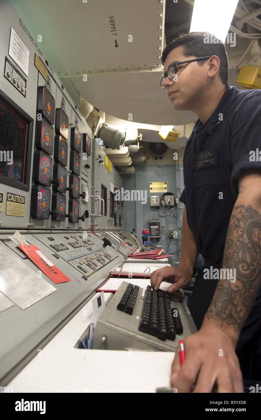 MEDITERRANEAN SEA (April 23, 2017) Machinist's Mate 2nd Class Zach Grandinetti, from Liverpool, New York, starts a gas turbine generator from the electronic plant control unit aboard USS Ross (DDG 71) April 23, 2017. USS Ross, an Arleigh Burke-class guided-missile destroyer, forward-deployed to Rota, Spain, is conducting naval operations in the U.S. 6th Fleet area of operations in support of U.S. national security interests in Europe and Africa. Stock Photo