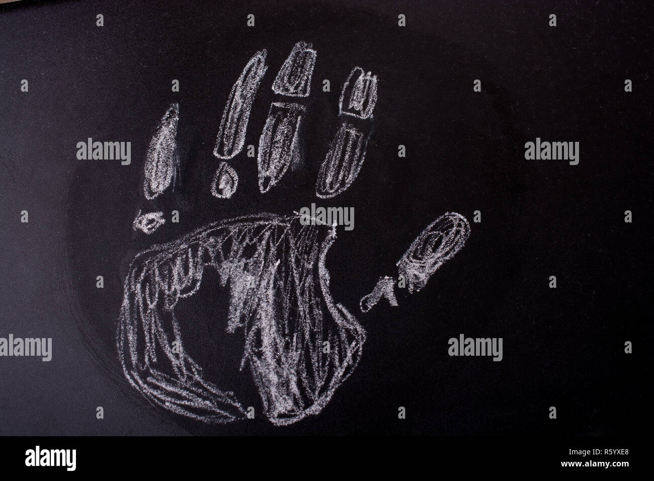Handprint drawn by white chalk on a blackboard Stock Photo Alamy