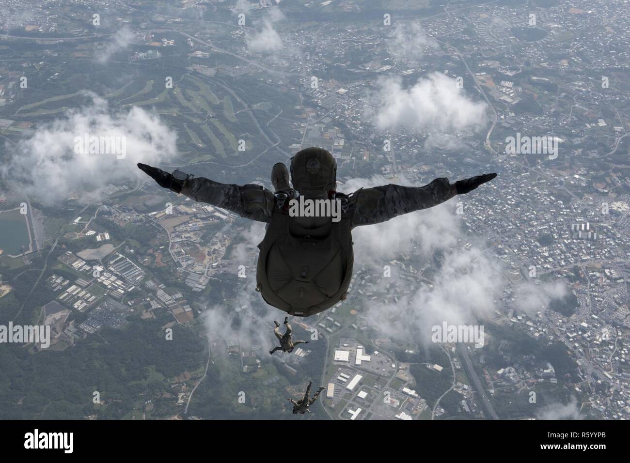 U.S. Air Force Airmen and U.S. Army Soldiers perform a high altitude ...