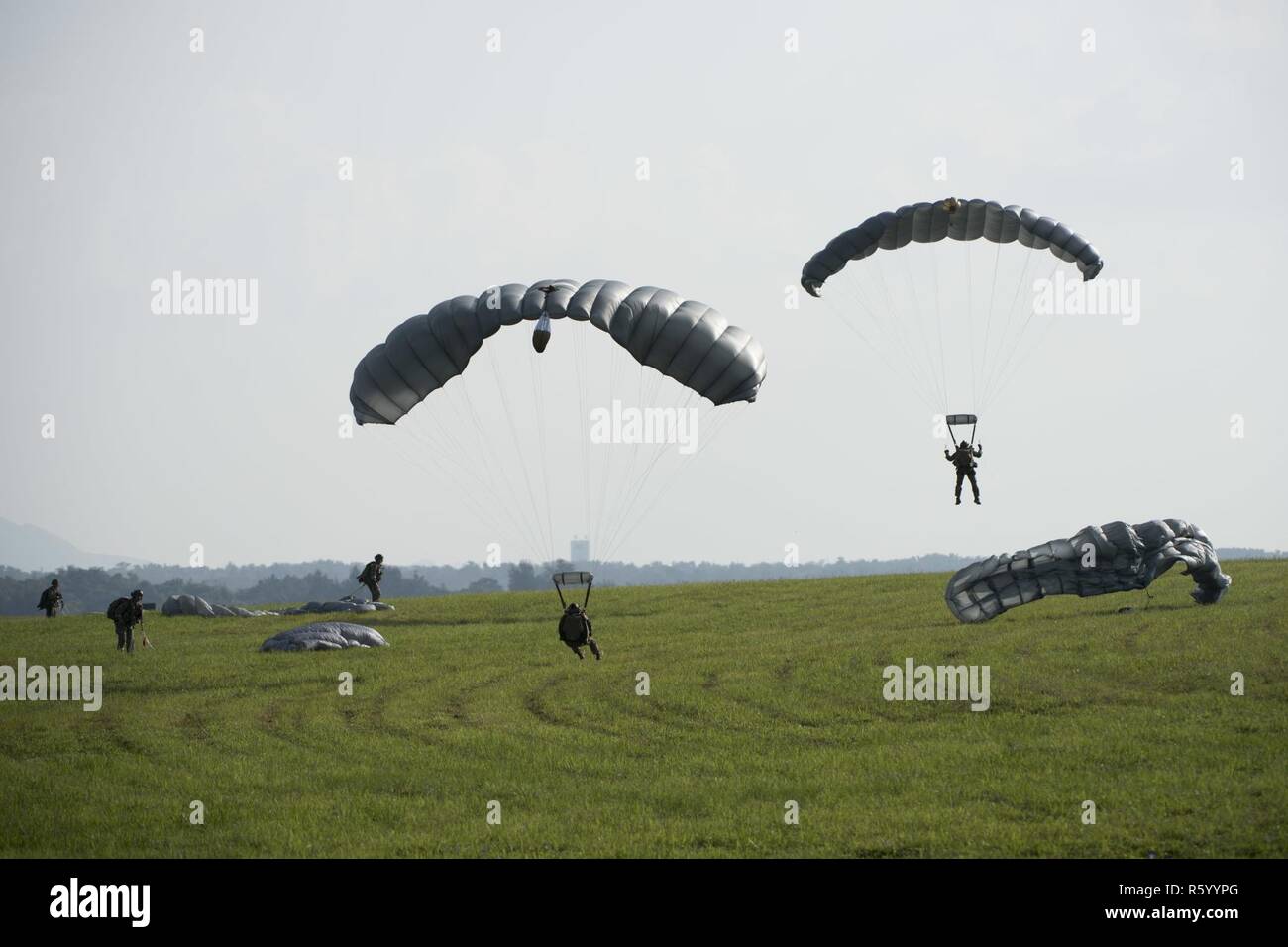 U.S. Air Force Airmen and U.S. Army Soldiers conduct parachute training ...