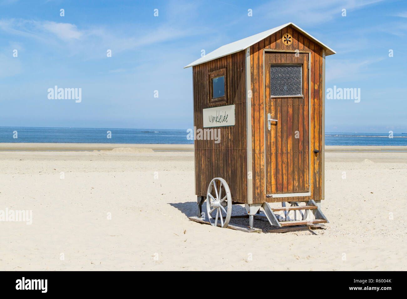 mobile dressing room on the beach. small wooden locker room on wheels