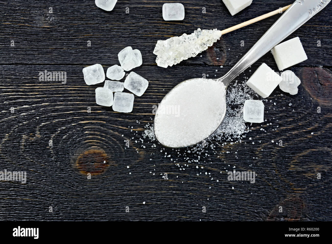 Sugar white in spoon on board top Stock Photo Alamy