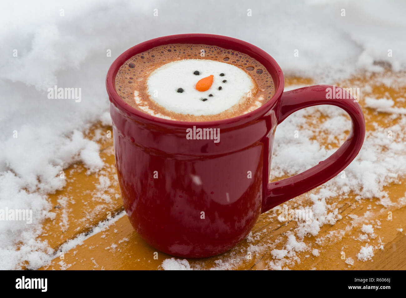 hot cocoa beverage mixed with Irish whiskey garnished with a smiling snow-person marshmallow Stock Photo