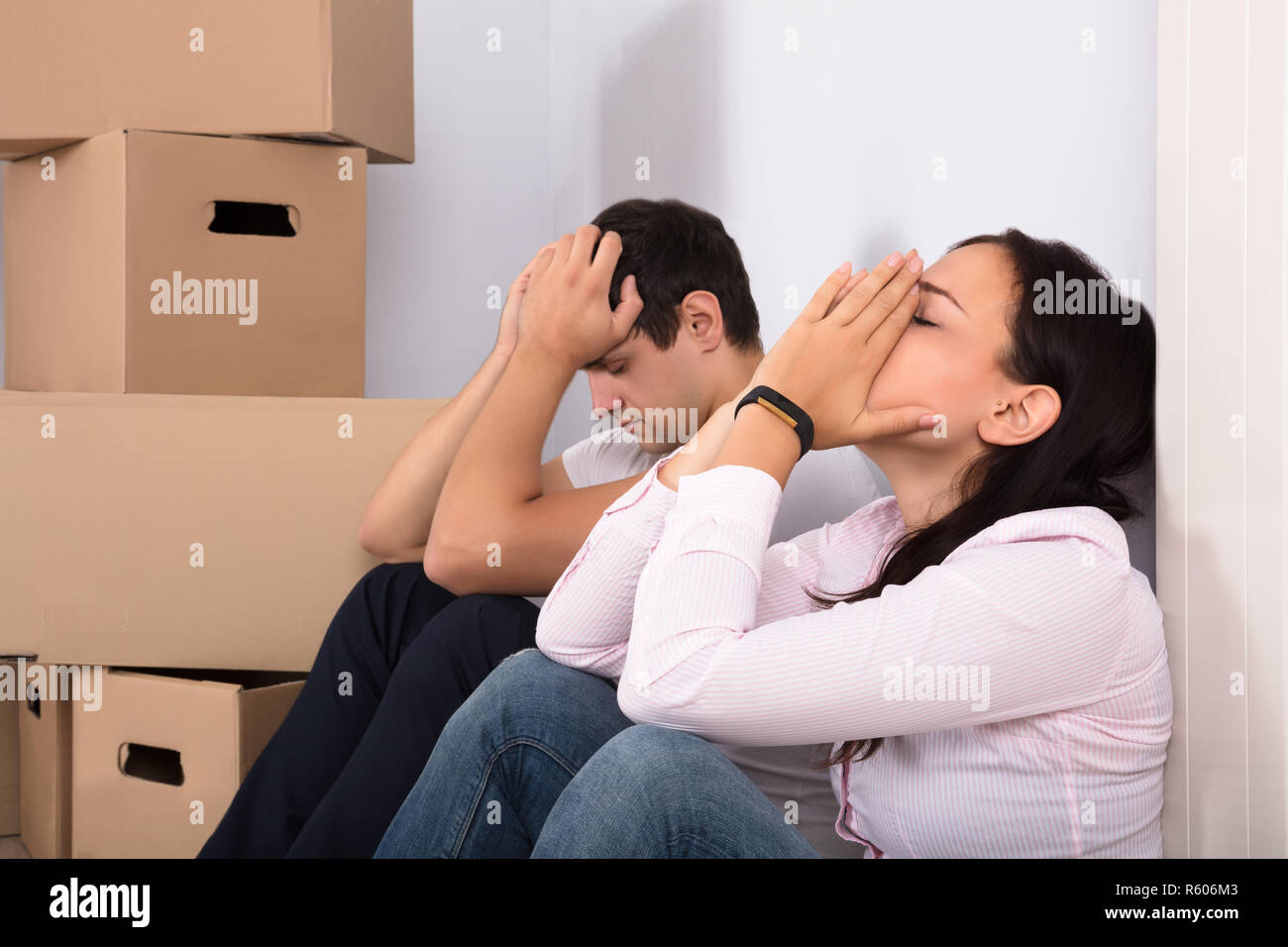 Sad Couple With Boxes Stock Photo