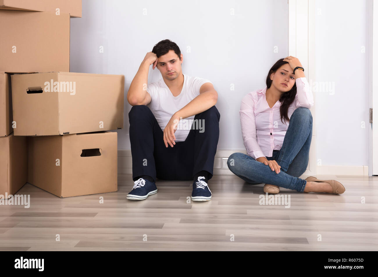 Sad Couple With Boxes Stock Photo