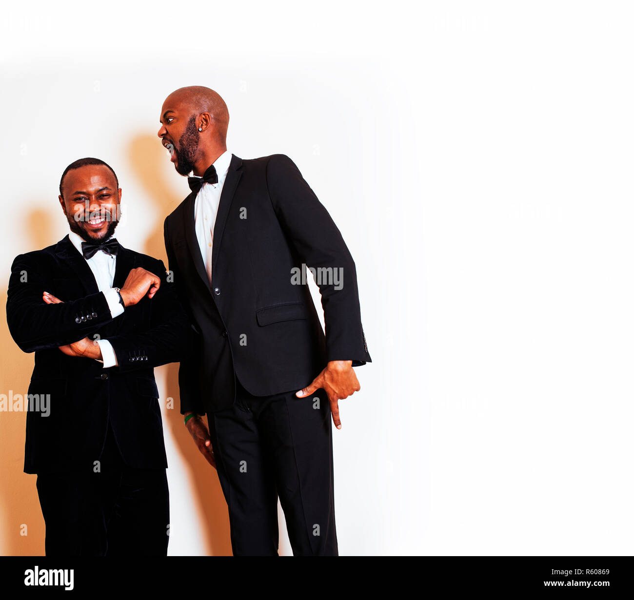 two afro-american businessmen in black suits emotional posing, g Stock ...