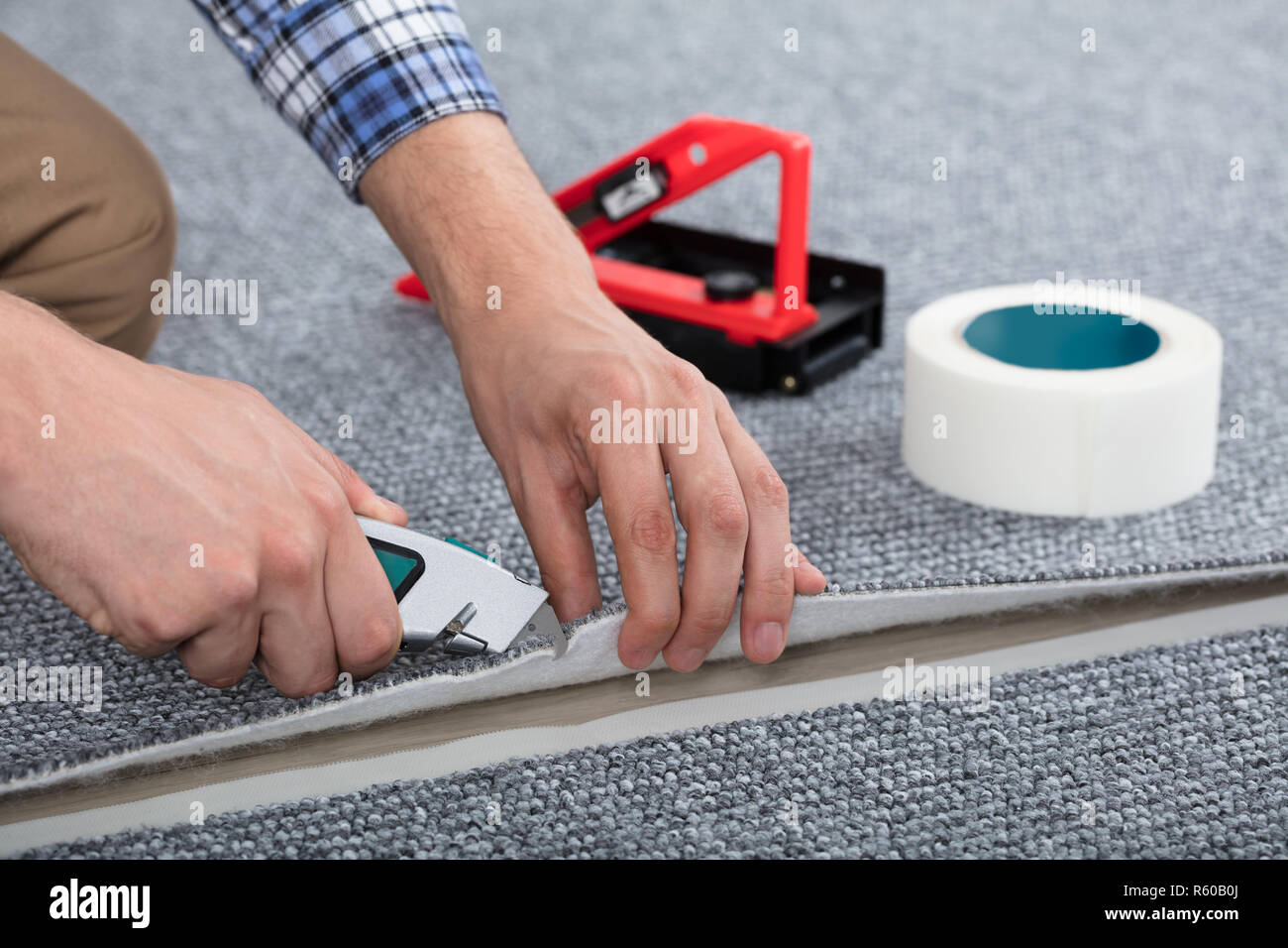 Carpenter Laying Carpet Stock Photo Alamy