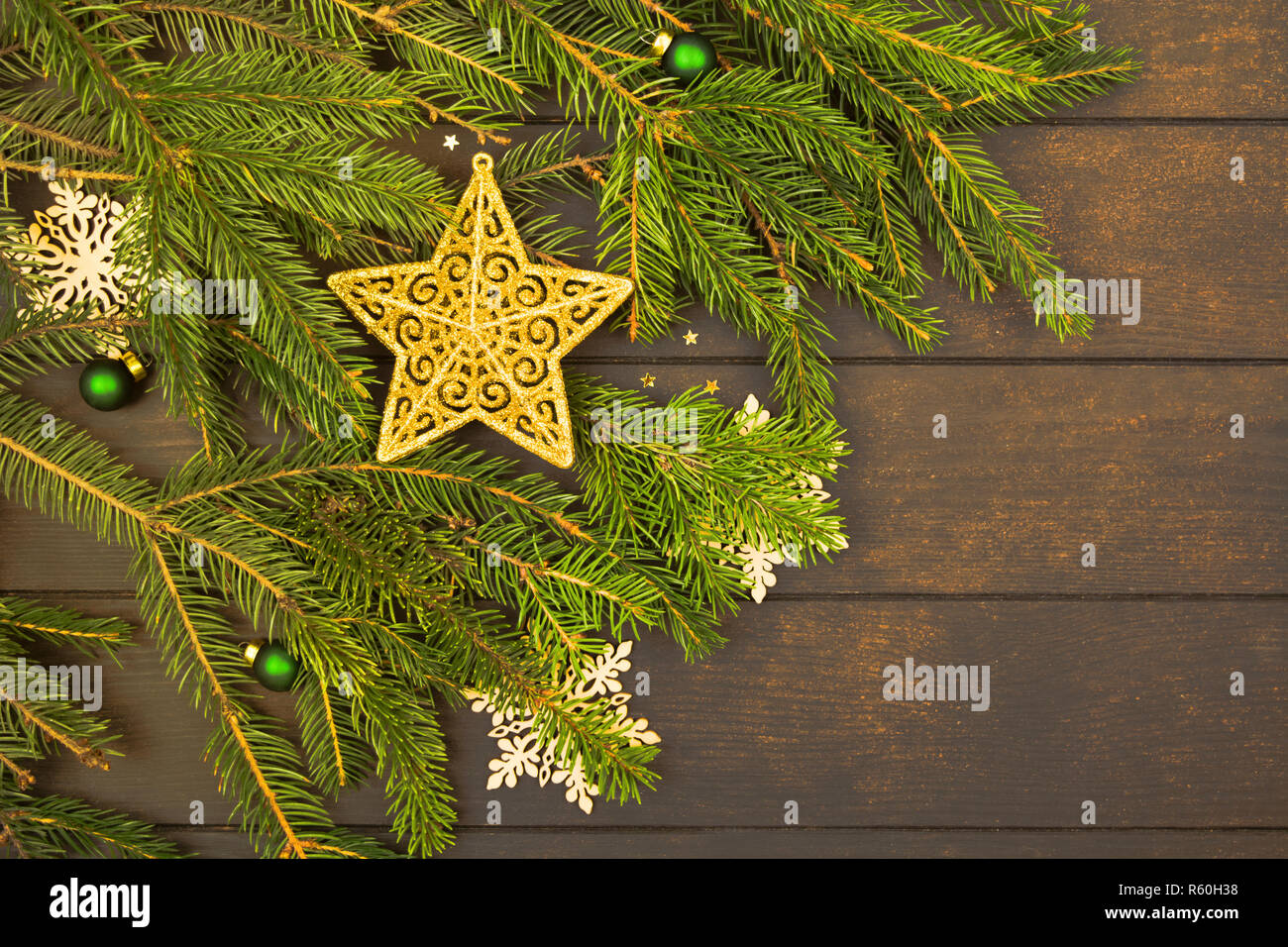 Christmas or New Year decoration with golden star on green fir tree ...