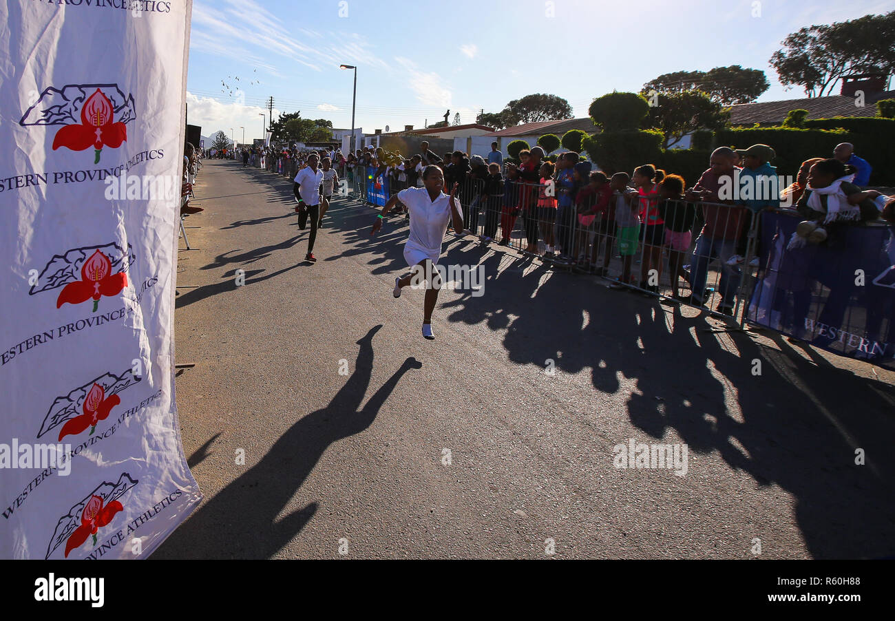 CAPE TOWN, SOUTH AFRICA - Wednesday 25 July 2018, members of the public, school children and residents of Prunus Street, Bonteheuwel, participate in the Western Province Athletics (WPA) Street Athletics programme.  Children of all ages and adults, get to run various distances from 50m to 200m in a closed-off street within a residential area. These events are organised by the WPA Development office and sponsored by the Old Mutual Two Oceans Marathon (OMTOM). Photo by Roger Sedres/ImageSA Stock Photo