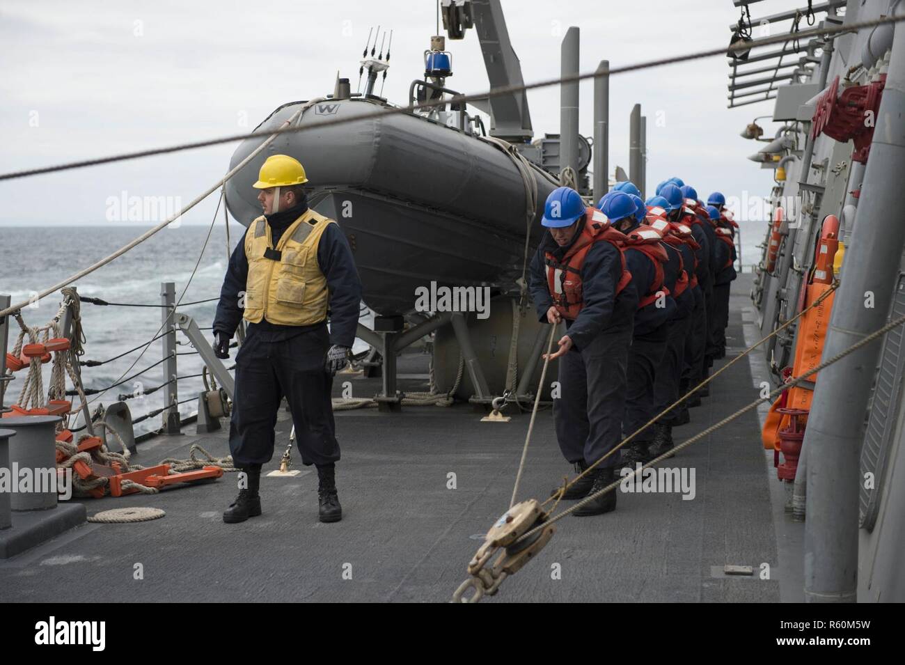 ATLANTIC OCEAN (April 27, 2017) - Line handlers heave a messenger line ...