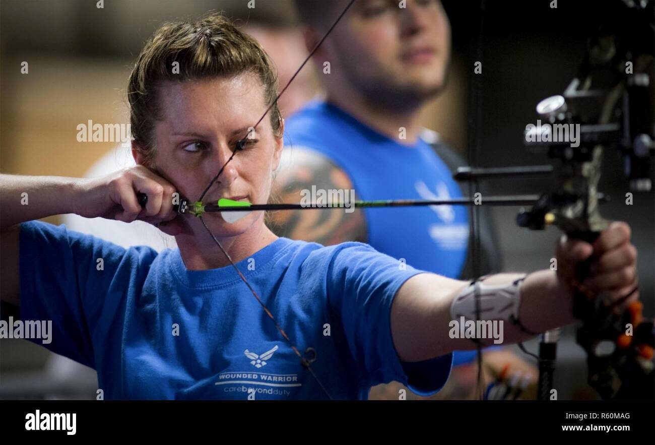 Melinda Smith, a Warrior Games athlete, takes aim at the bullseye
