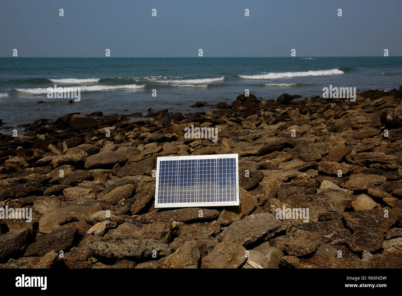 A solar panel lies under the sun on the sea beach at Saint Martin Island. Cox’s Bazar, Bangladesh. Stock Photo