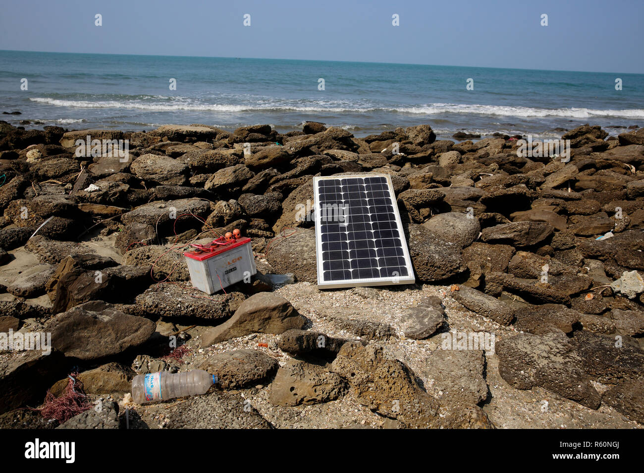 A solar panel lies under the sun on the sea beach at Saint Martin Island. Cox’s Bazar, Bangladesh. Stock Photo
