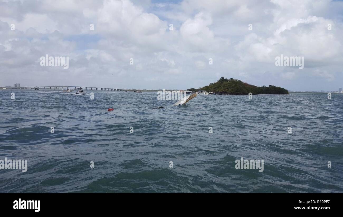 cigarette boat jumping waves powerboat taking on and crushing a rough Boca Inlet Offshore boat jumping massive breaking