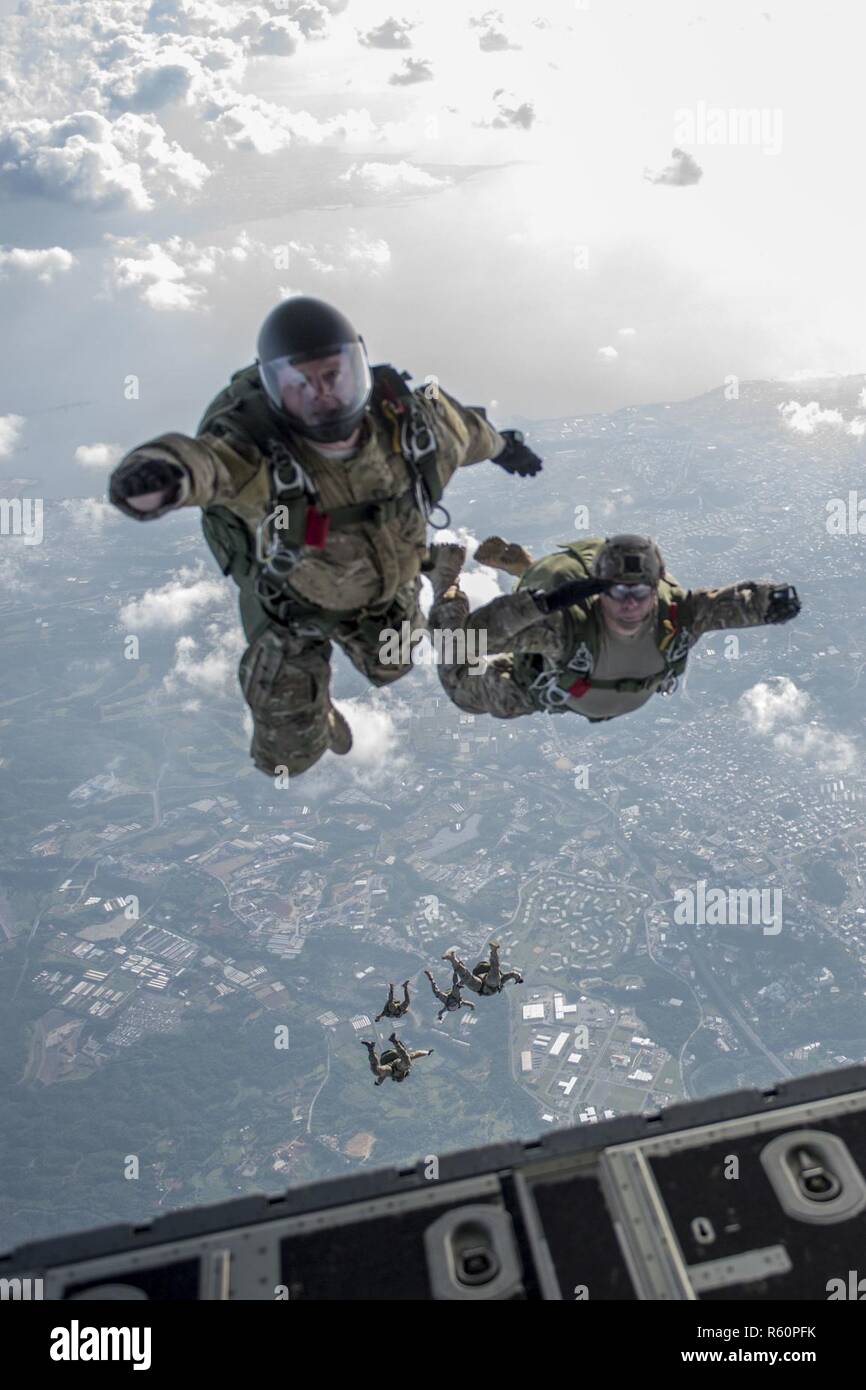 U S Airmen Render A Salute As They Conduct A High Altitude Low Opening Jump Off An Mc 130j Commando Ii April 24 17 Above Okinawa Japan Kadena Air Base Land And Water Drop U S Airmen Render A Salute As They Conduct A High Altitude Low Opening Jump Off An Mc 130j Commando Ii April 24 17 Above Okinawa Japan Kadena Air Base Land And Water Drop