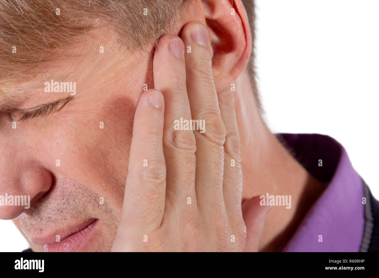 Man has a sore ear. Man suffering from earache Stock Photo Alamy