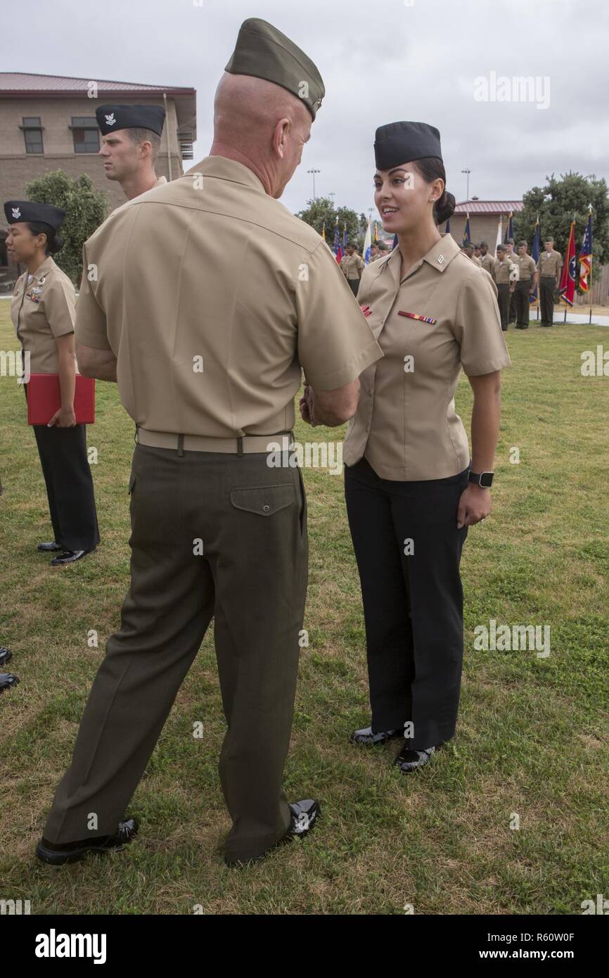 17U.S. Navy Seaman Nicole Beckman receives a Bluejacket of the Quarter