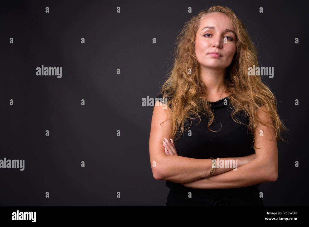 Portrait of confident businesswoman with arms crossed Stock Photo