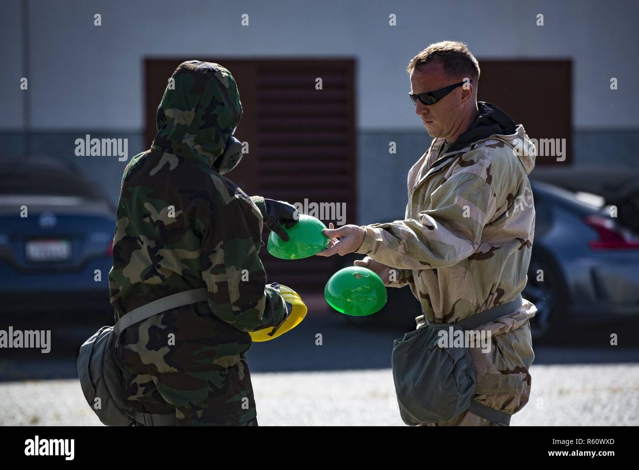 U.S. Marine Staff Sgt. Philip Barnes hands out cones to conduct Reconnaissance, Surveillance and Decontamination Training aboard Marine Corps Base Camp Pendleton, Calif., April 26, 2017. The cones serve as simulated threats and hazards in a chemical, biological, radiological and nuclear environment. The purpose of this training is to accomplish missions within CBRN environment.  Barnes is the current CBRN Chief for 1st Maintenance Battalion, 1st Marine Logistics Group. Stock Photo