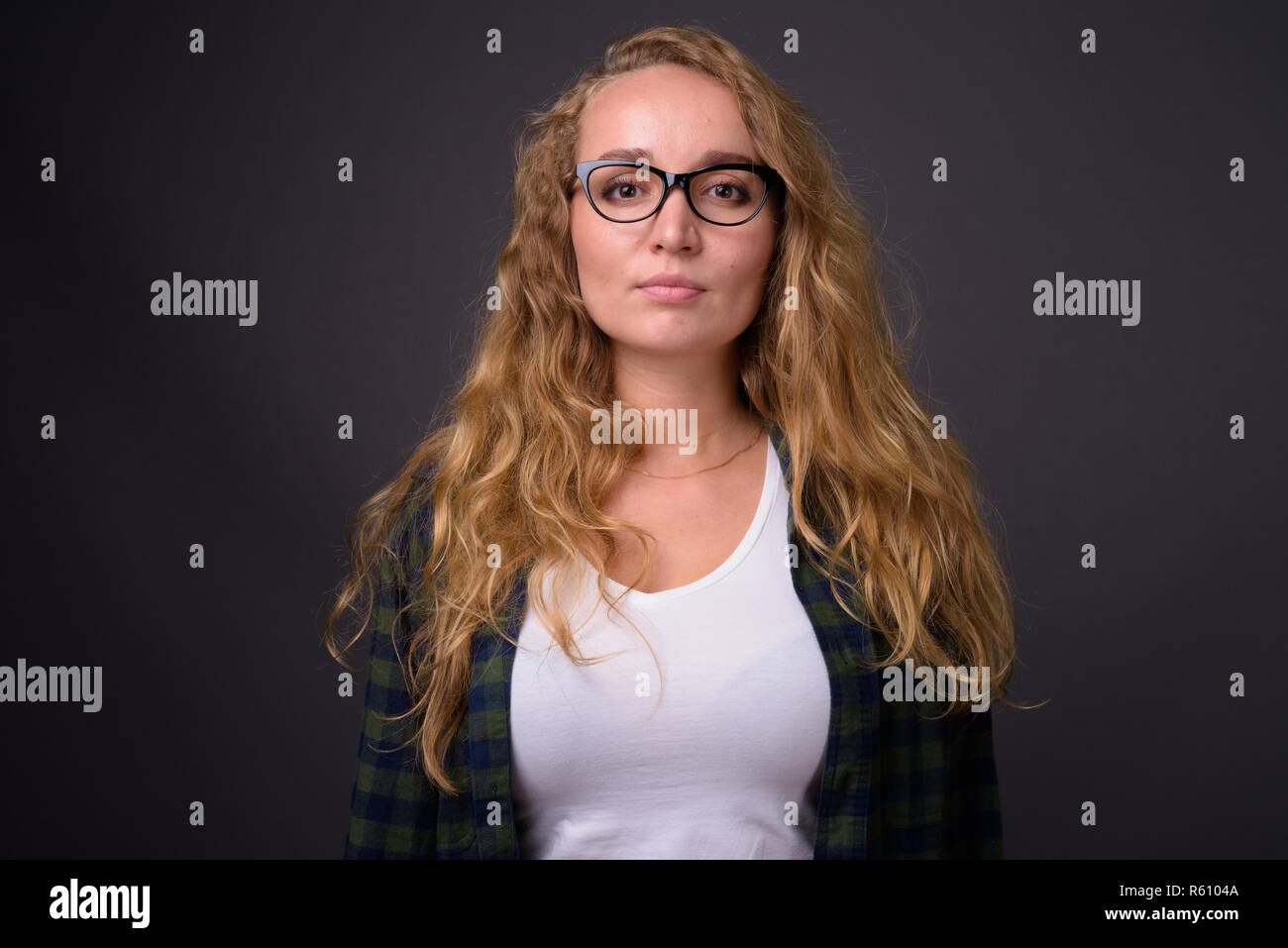 Portrait of young beautiful woman with long wavy blond hair Stock Photo ...