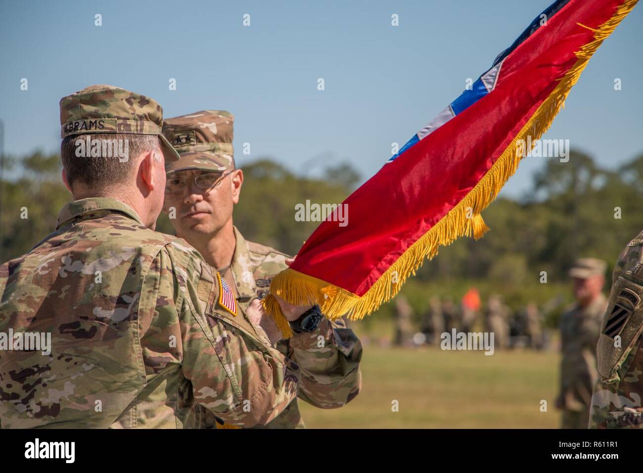 Gen. Robert Abrams (left), commander of U.S. Army Forces Command and ceremony officiator for the 3rd Infantry Division change of command ceremony, passes the division colors to incoming commander Maj. Gen. Leopoldo Quintas at Cottrell Field, Fort Stewart, Ga., May 8, 2017. Stock Photo