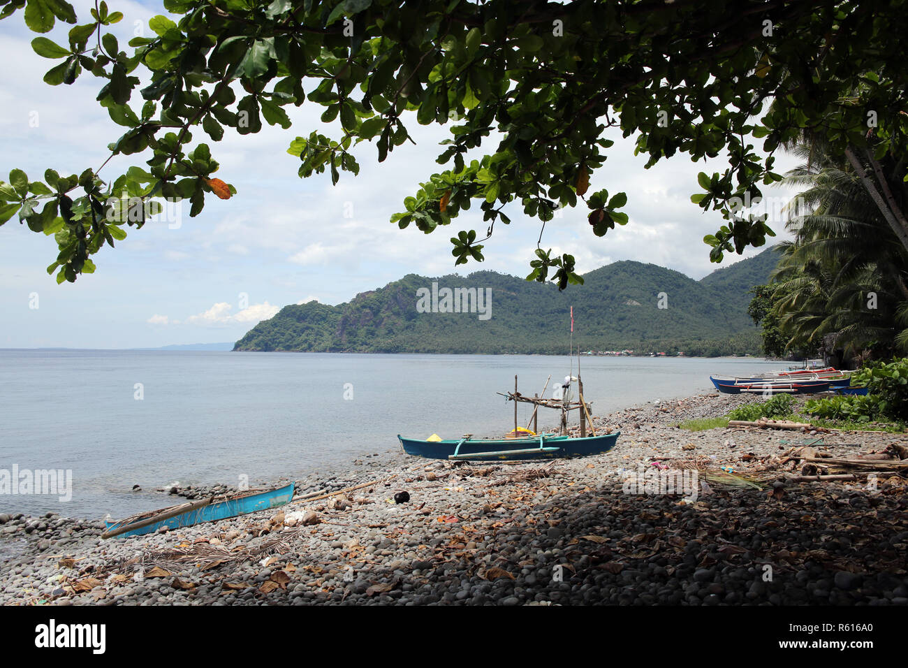 fishing boat on the pebble beach Stock Photo