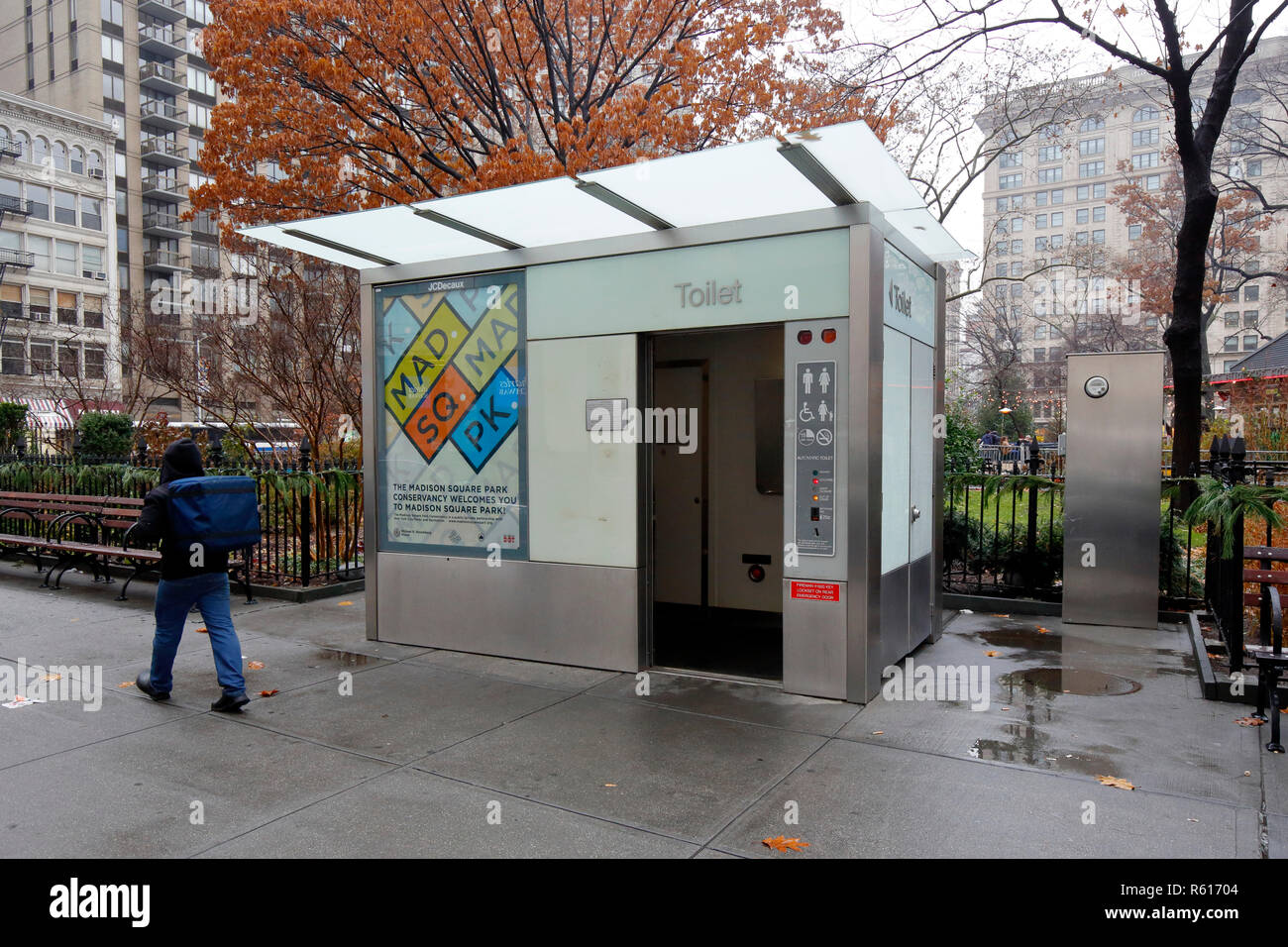 An automatic, self cleaning public pay toilet, public restroom--one of only five in New York City--in Madison Square Park. This one out of order. Stock Photo