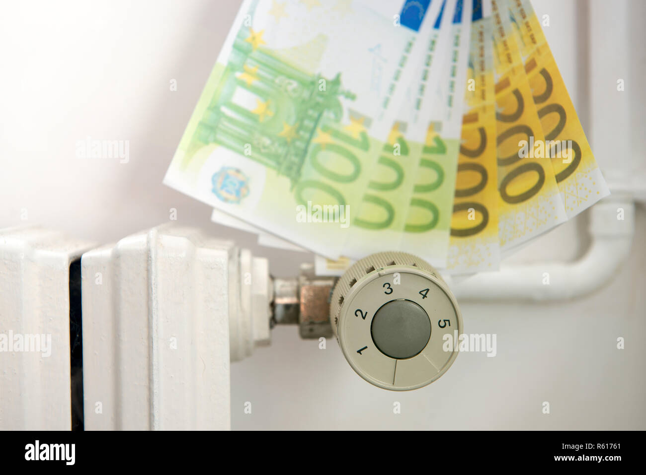 Heating thermostat with euros, expensive heating concept Stock Photo