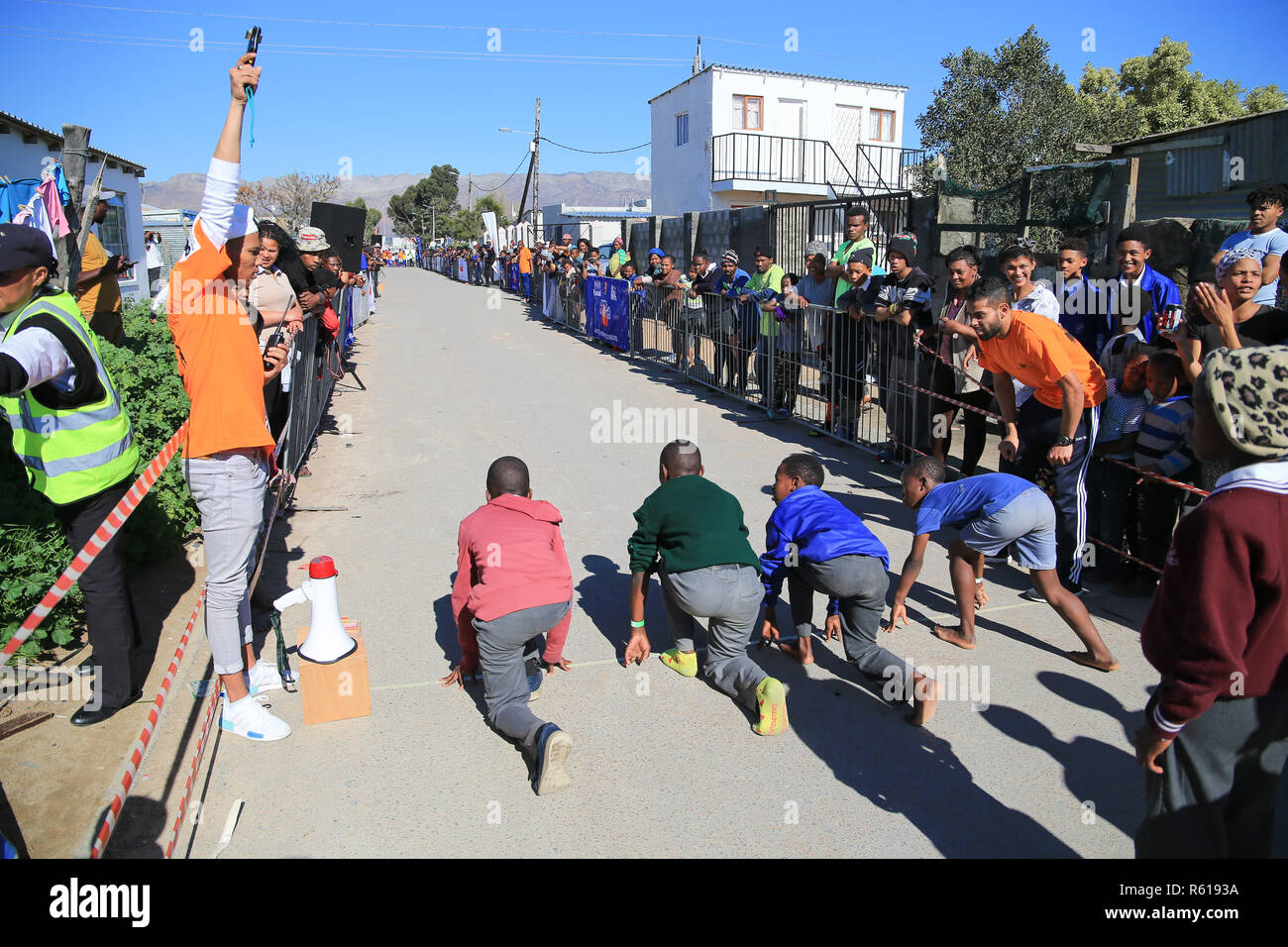 CAPE TOWN, SOUTH AFRICA - Wednesday 29 August 2018, members of the public, school children and residents of Lumka Street in Nomzamo in Strand, participate in the Western Province Athletics (WPA) Street Athletics programme.  Children of all ages and adults, get to run various distances from 50m to 200m in a closed-off street within a residential area. These events are organised by the WPA Development office. Photo by Roger Sedres for WP Athletics Stock Photo