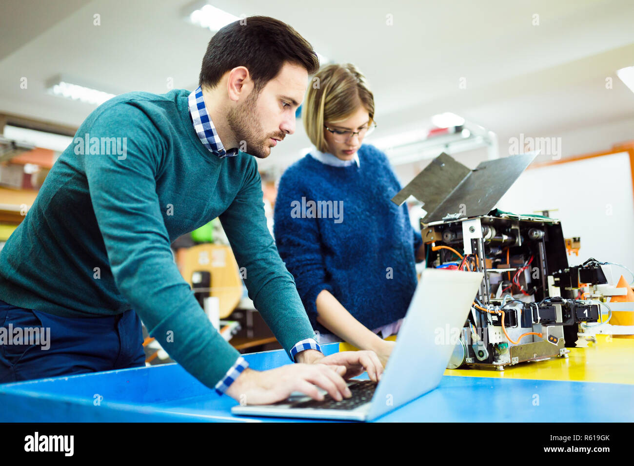 Young students of robotics working on project Stock Photo