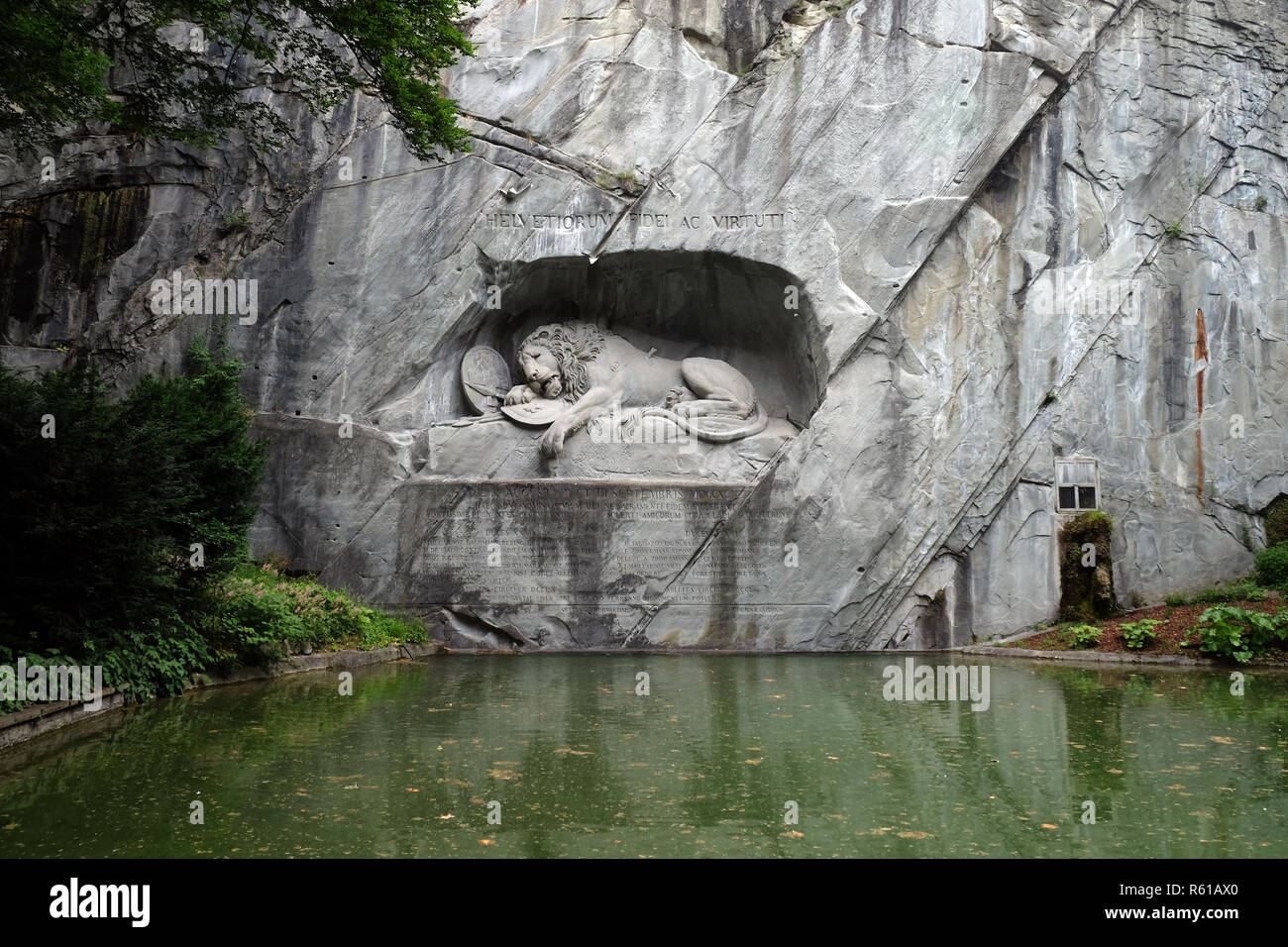 The Lion Monument or the Lion of Lucerne, designed by Bertel Thorvaldsen is a rock relief in Lucerne, Switzerland Stock Photo