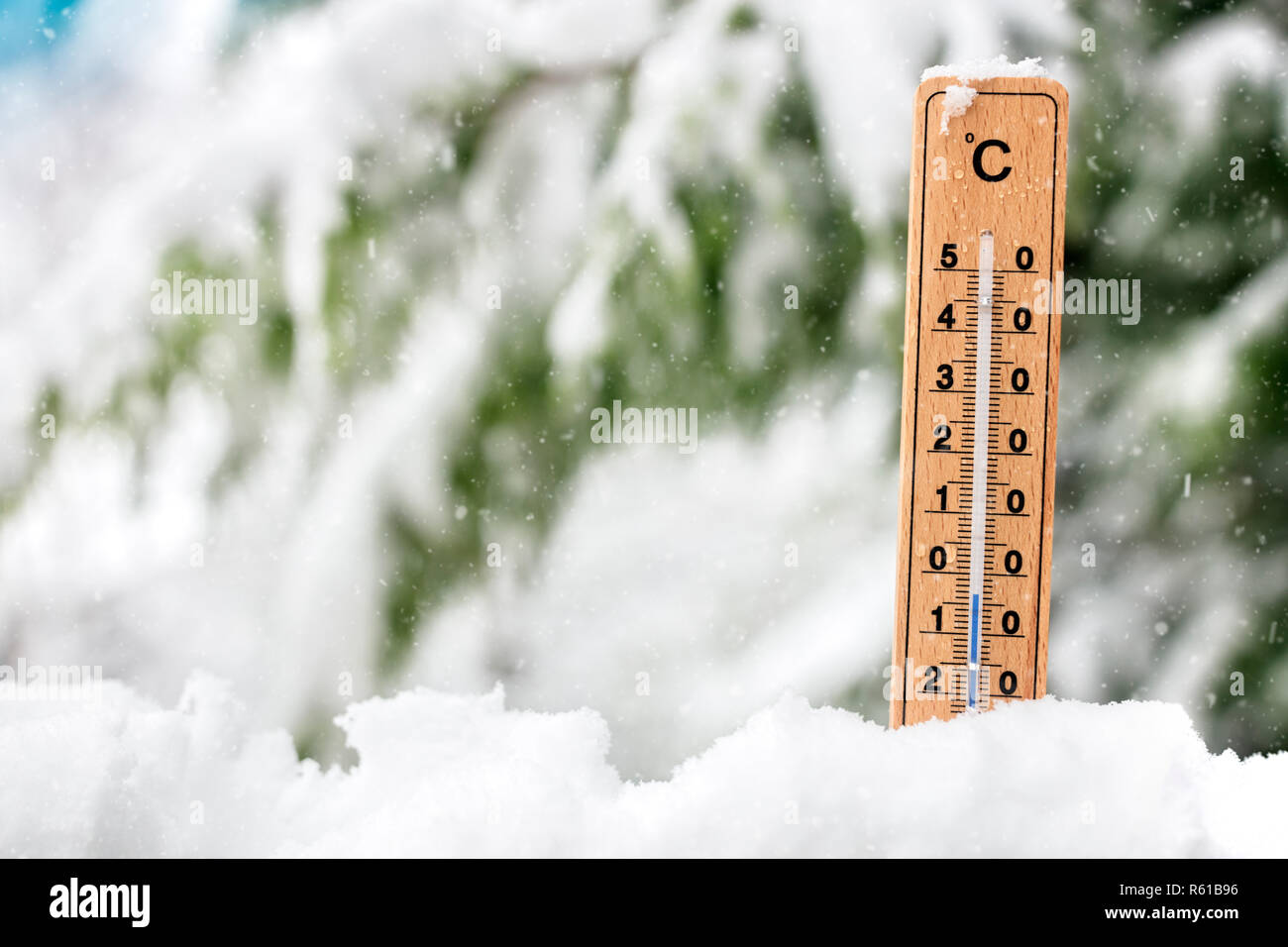 Thermometer showing freezing cold temperature in the snow concept for winter Stock Photo