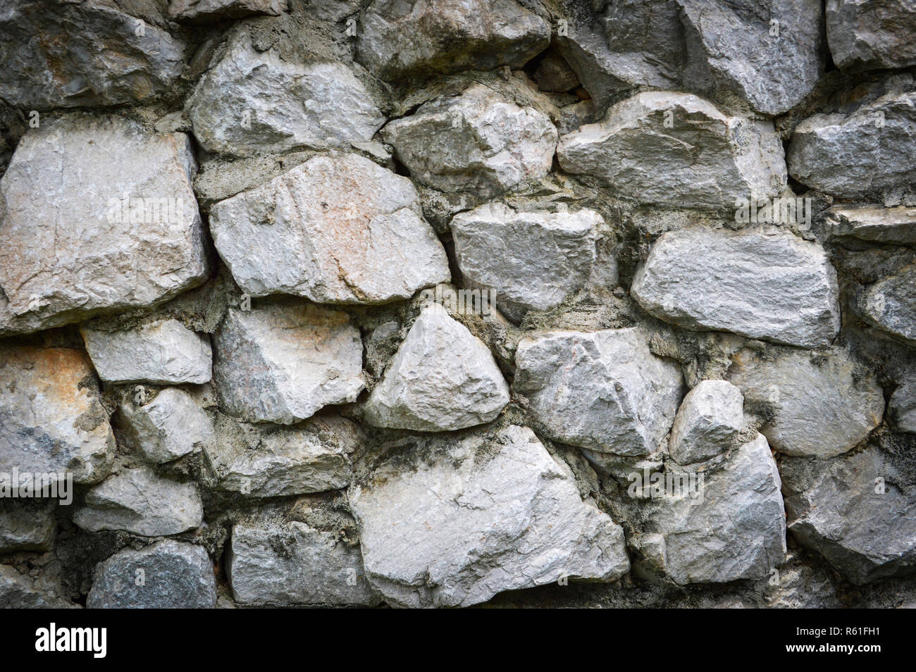 stone background with cement / wall stone texture background / the rock