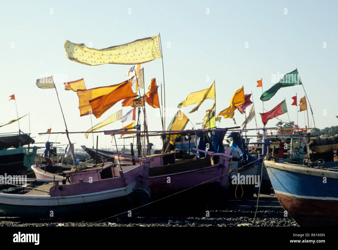 Fishing boats with colorful flags, manori across marve, malad, india Stock Photo