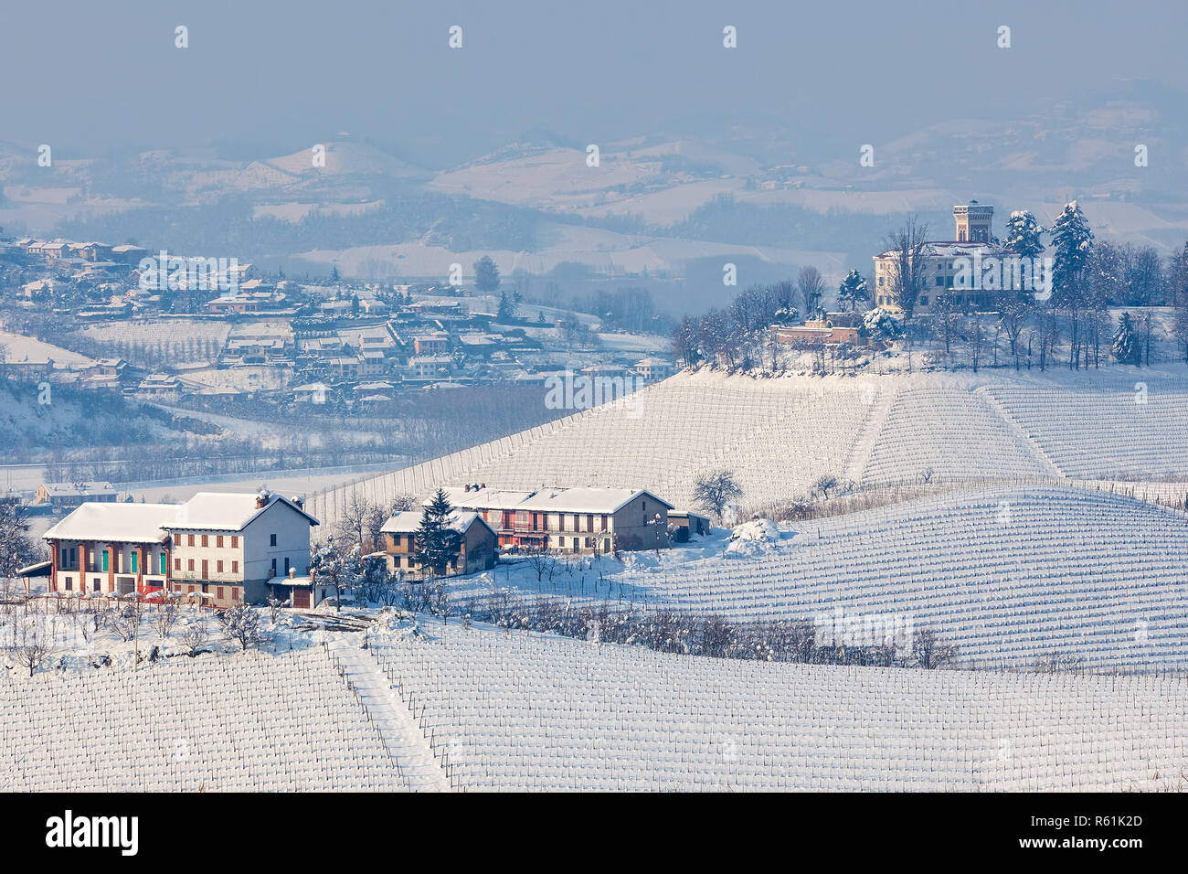 View of snowy hills and vineyards of Langhe region in Piedmont, Northern Italy. Stock Photo