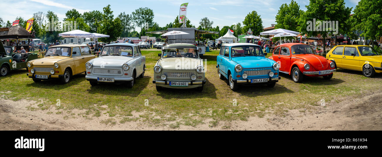 PAAREN IM GLIEN, GERMANY - MAY 19, 2018: Panoramic view of German vintage cars (Trabant, VW Beetle, VW Golf). Die Oldtimer Show 2018. Stock Photo