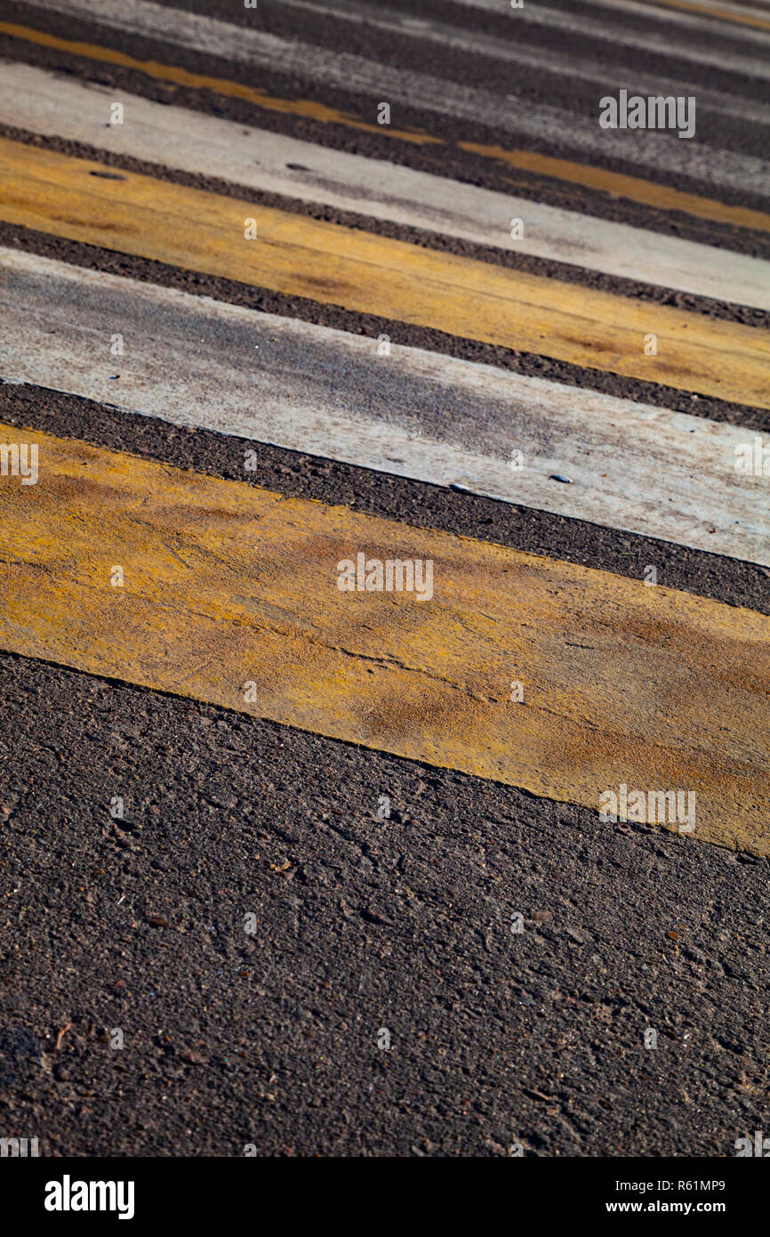 Pedestrian crossing with white and yellow stripes close-up Stock Photo ...