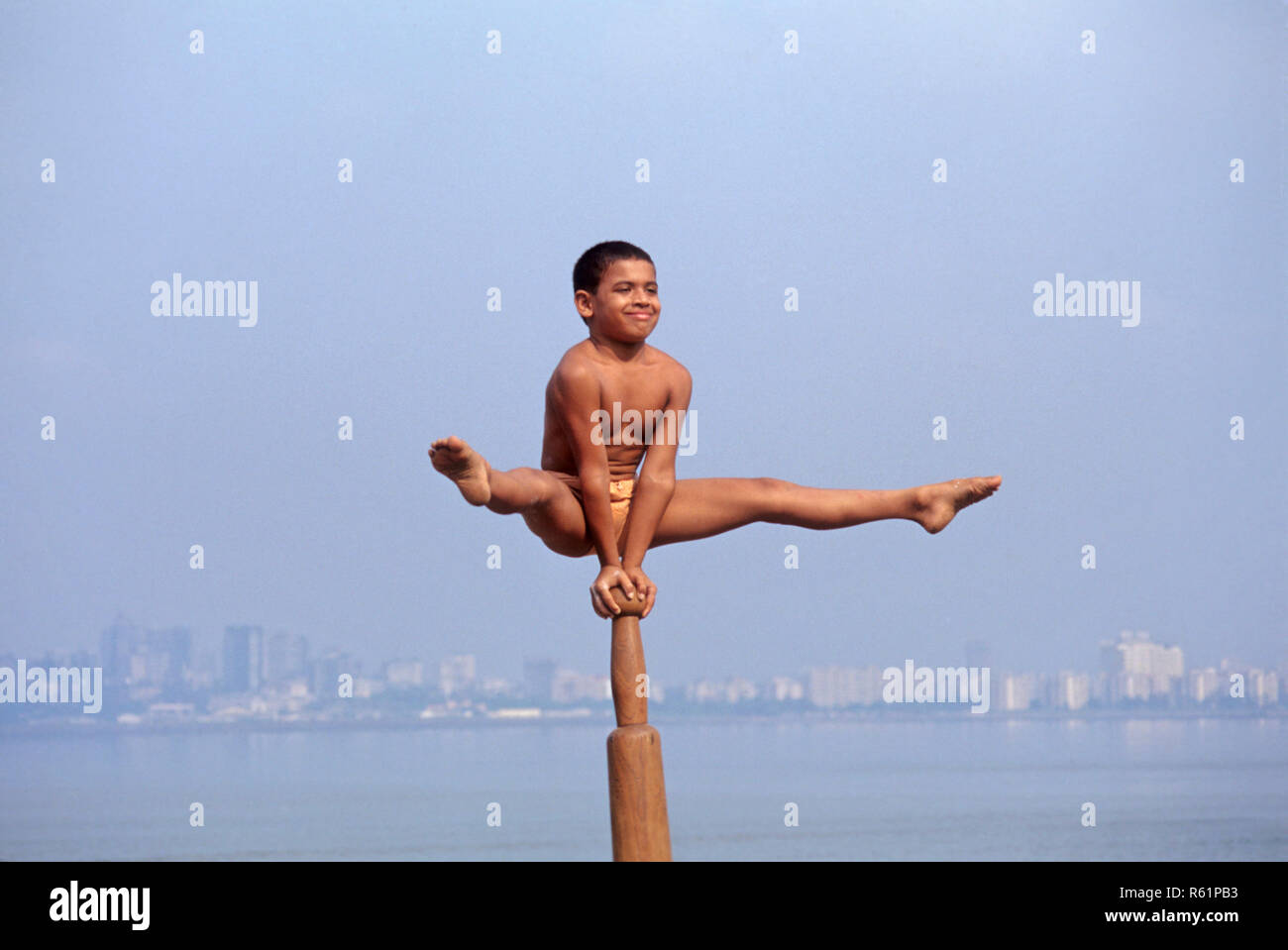 Mallakhamba or Mallakhamb traditional sport boy doing aerial yoga Chowpatty Bombay Mumbai Maharashtra India Asia Stock Photo