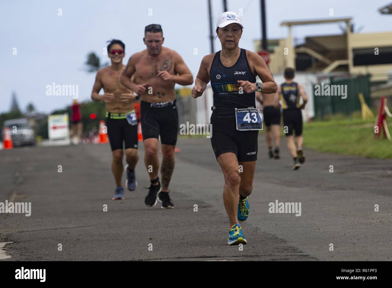 Participants of the H3 Triathlon Race to the Base navigate Marine Corps